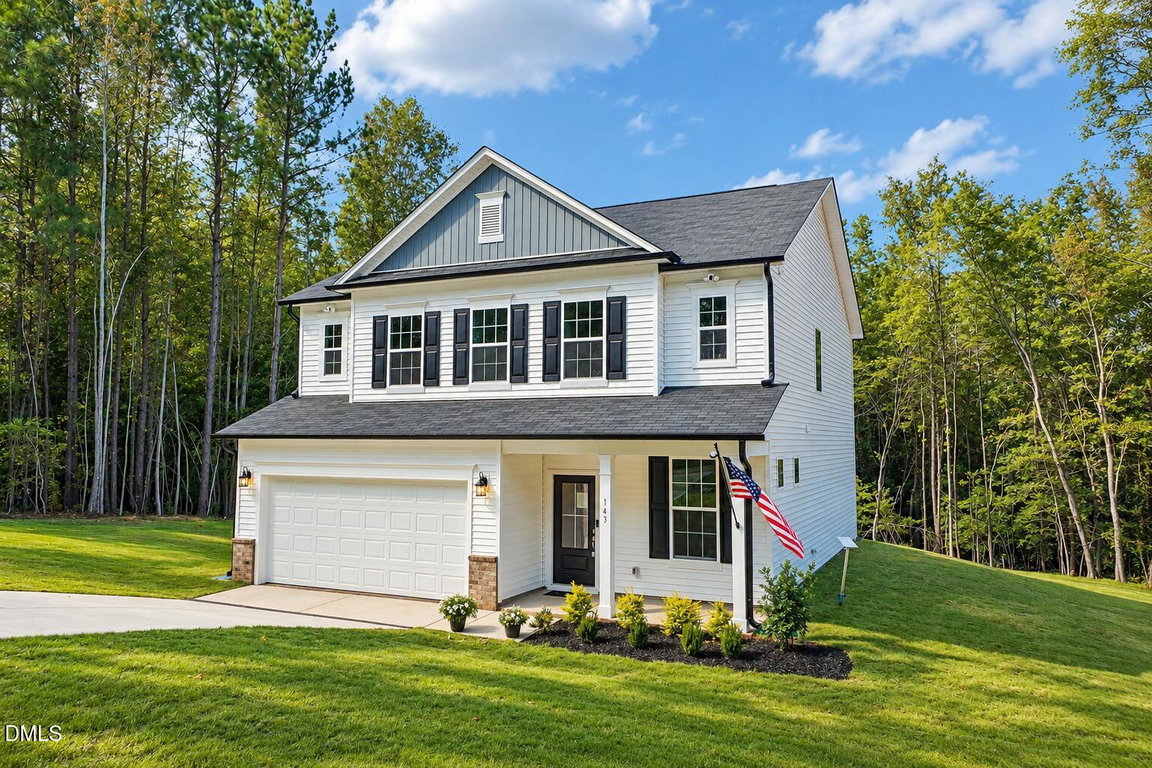 Sunny Woodland Home with American Flag