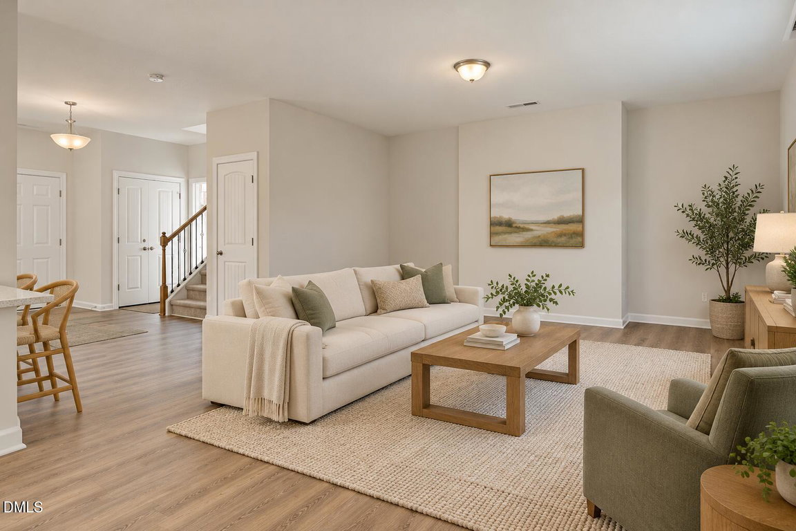 Sunlit family room with warm oak floors-