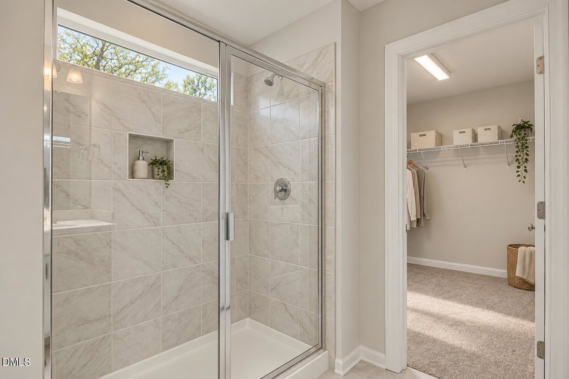 Marble-Tile Primary Bathroom and Closet