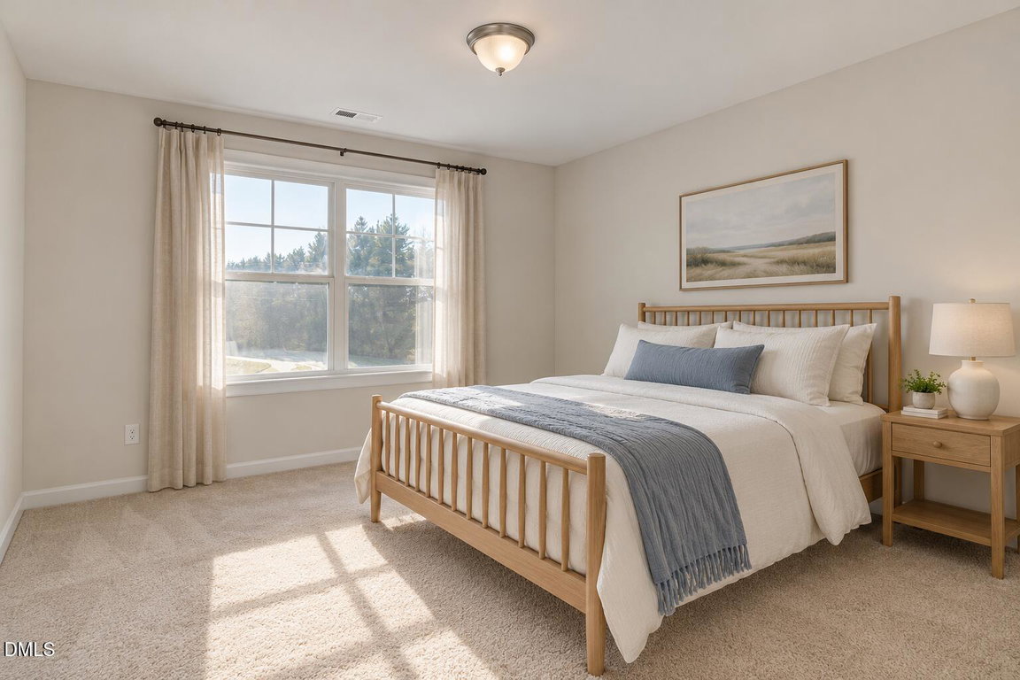 Sunlit bedroom with oak spindle bed-17