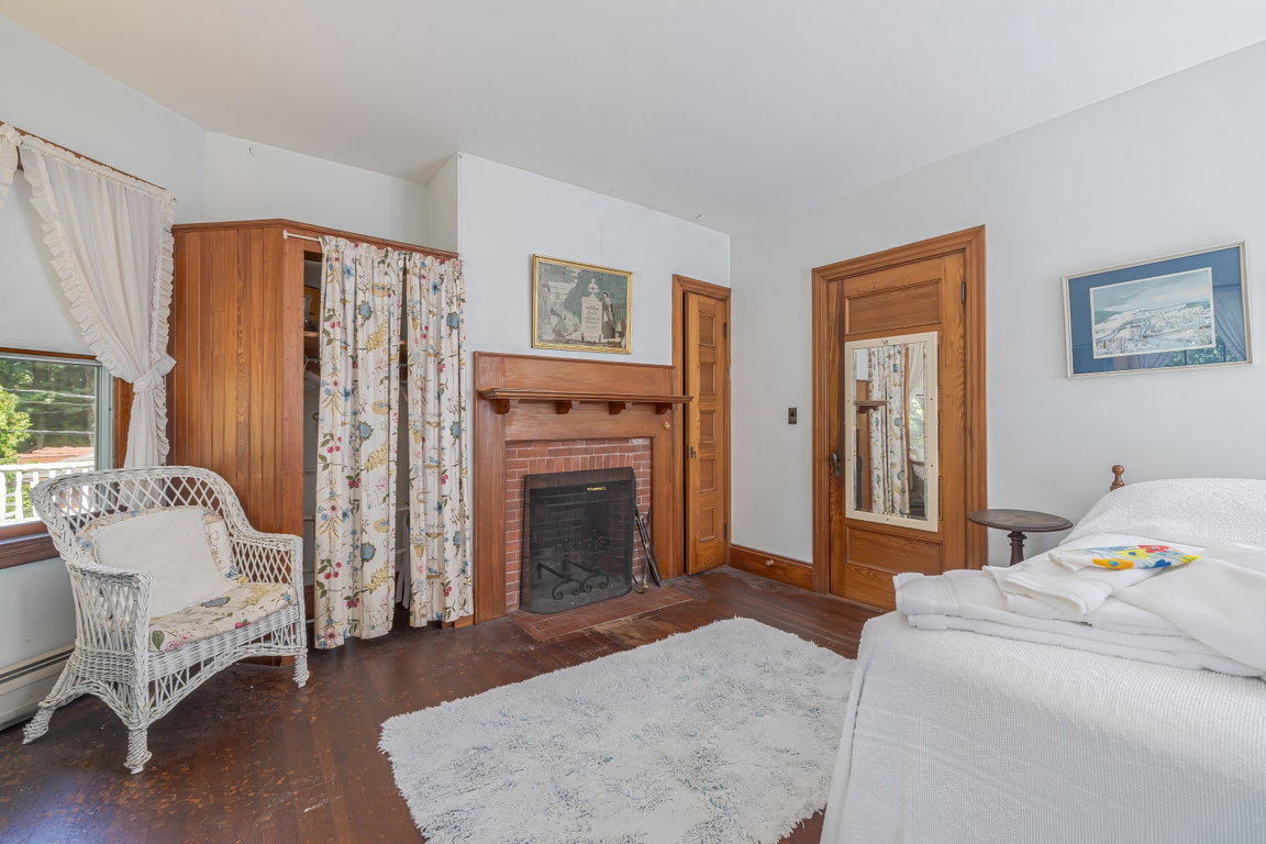 2nd floor bedroom with fireplace