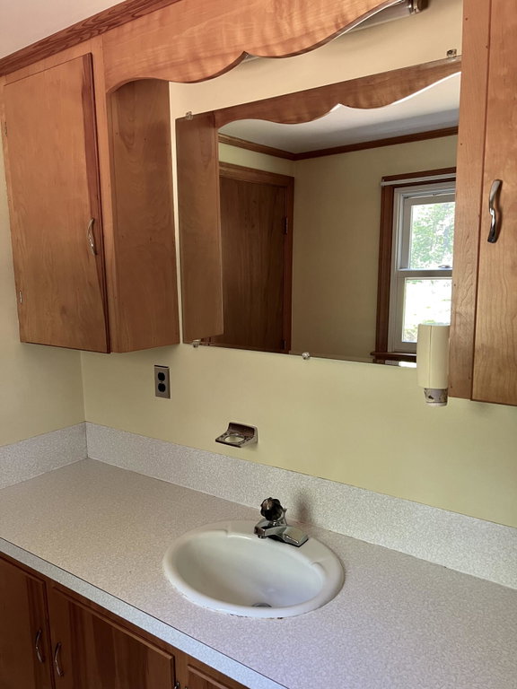 Half bath off of primary bedroom