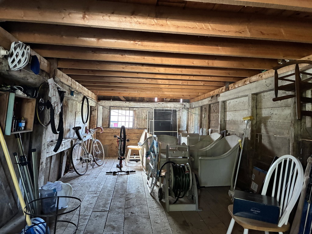 Storage under south hayloft.