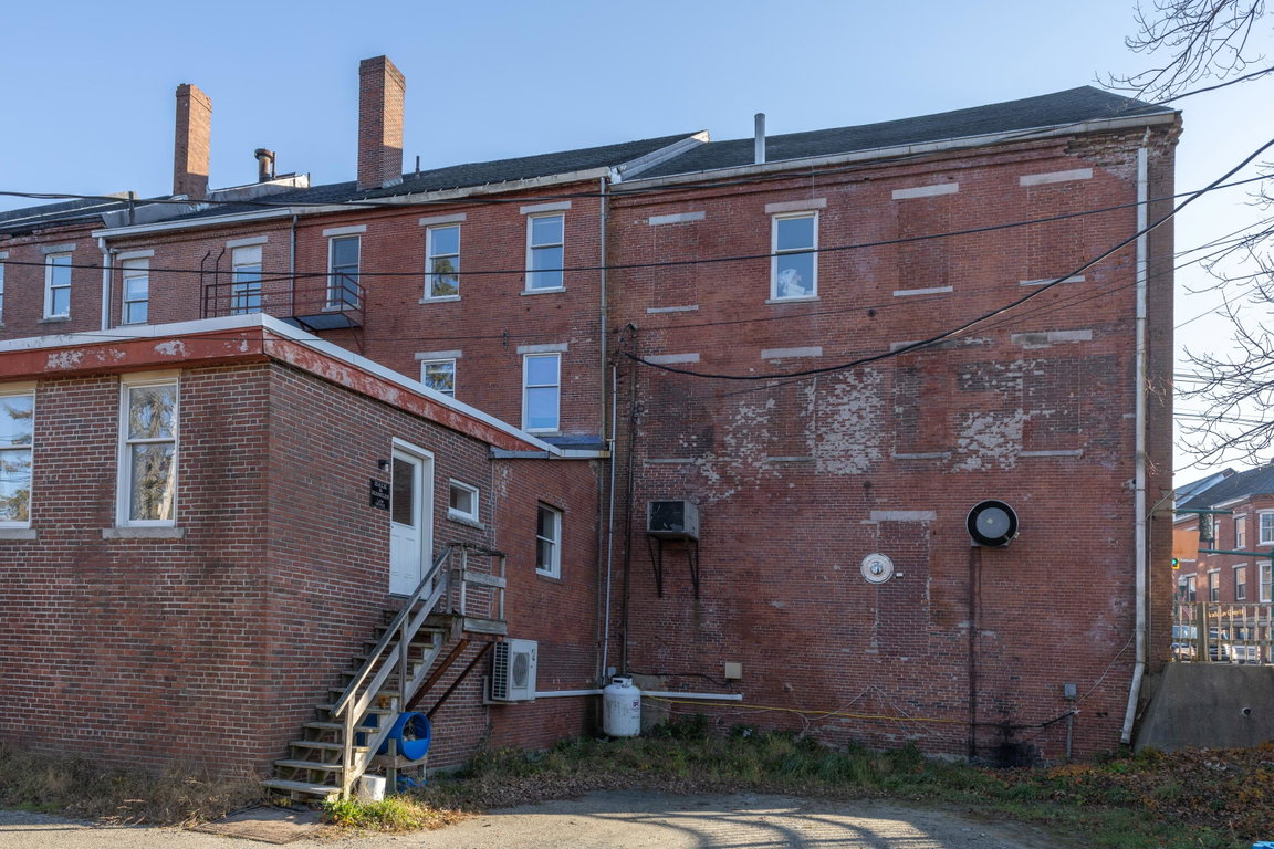 Rear of buildings w/addition.