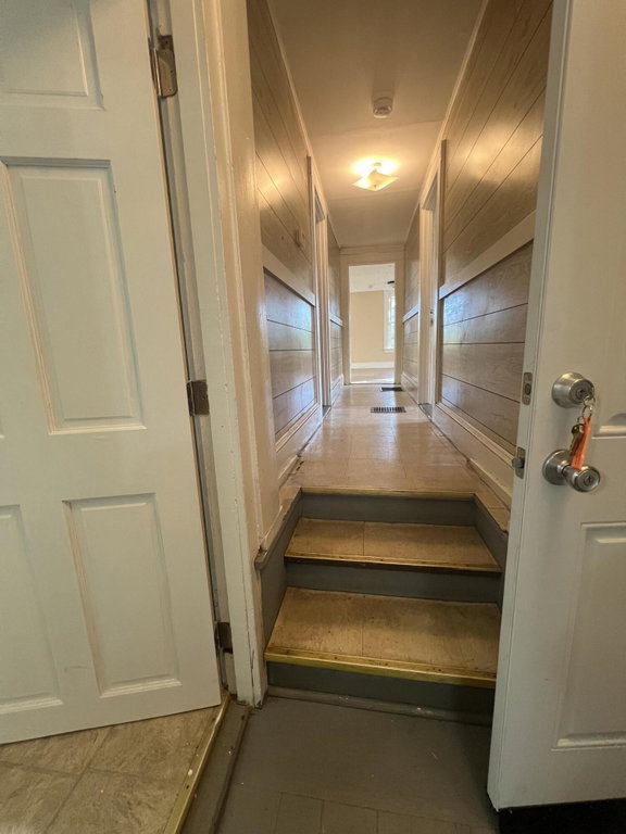 Hallway to bedrooms and living room at t