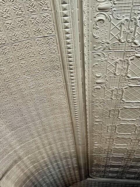 Tin ceiling detail in ballroom.