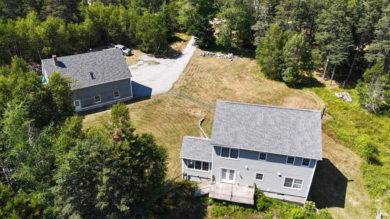 back of house with garage