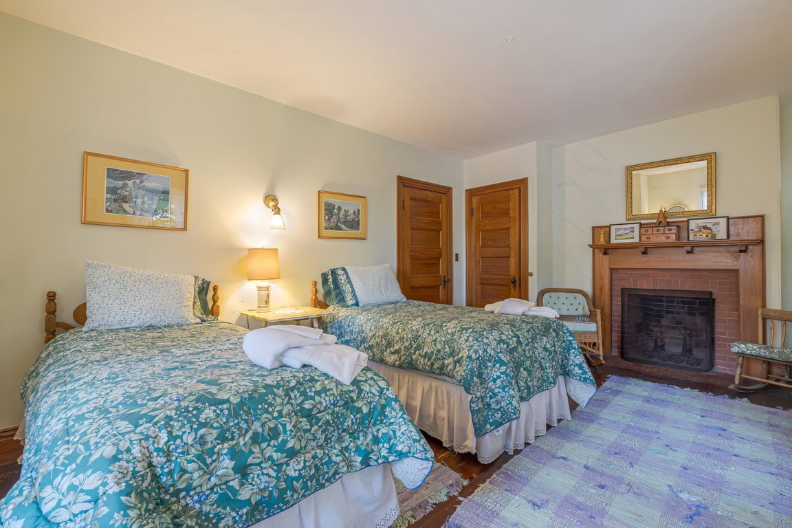 2nd floor bedroom with fireplace