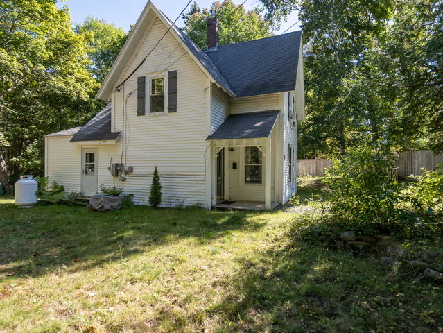 Restored, in-town cottage with a 1 acre fenced lot.