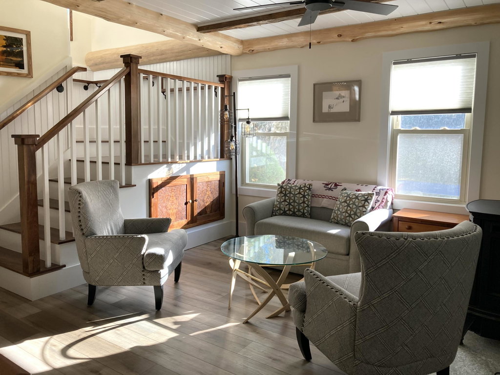 Living room w/stairwell to 2nd floor.