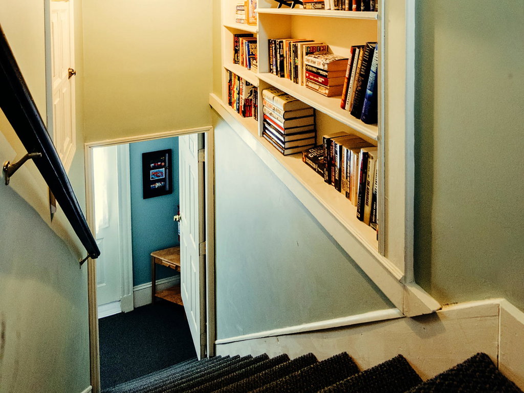 3rd floor stairs and bookshelves-MLS