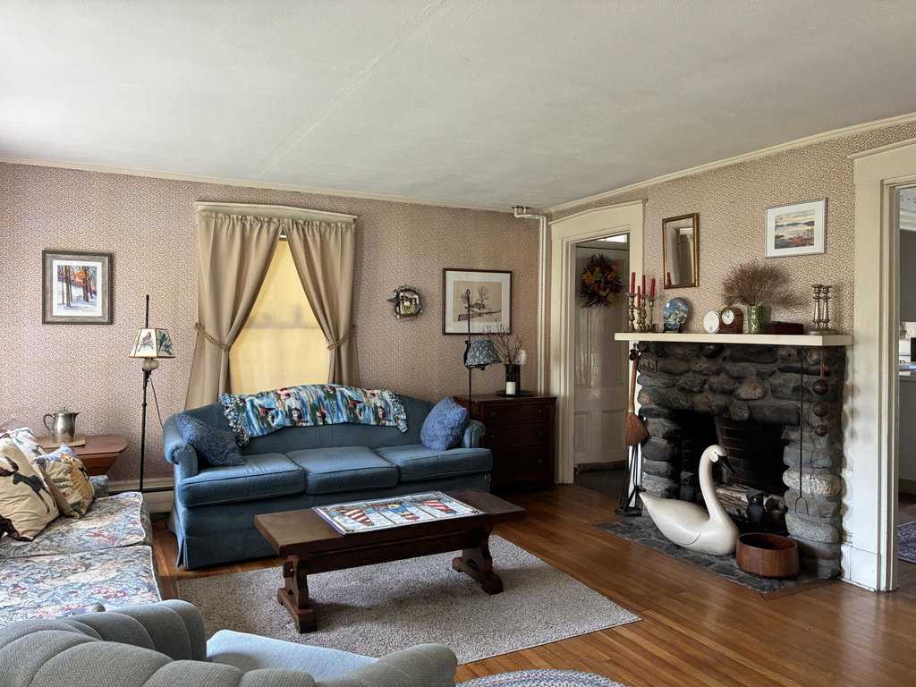 Woodburning fireplace in living room.