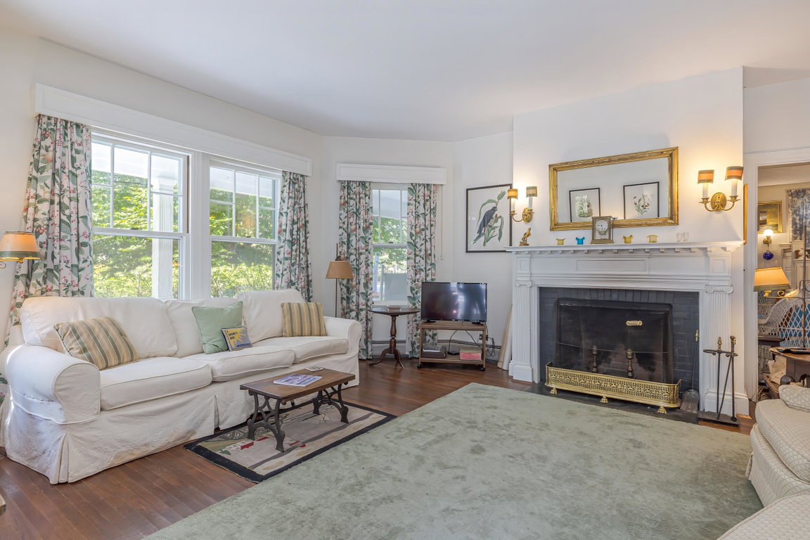 Living room with wood burning fireplace
