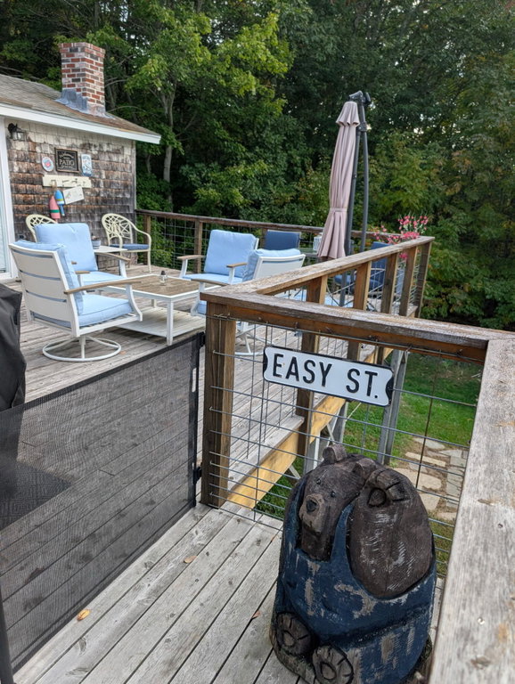 The deck wraps around to the entrance